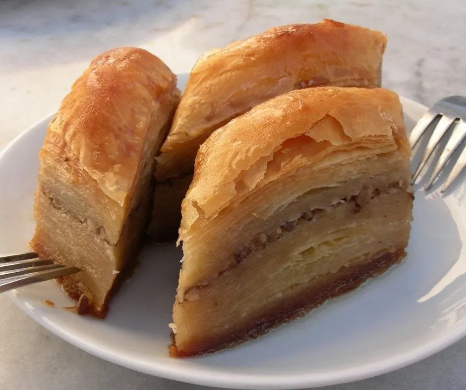 Layering filo and walnuts for baklava
